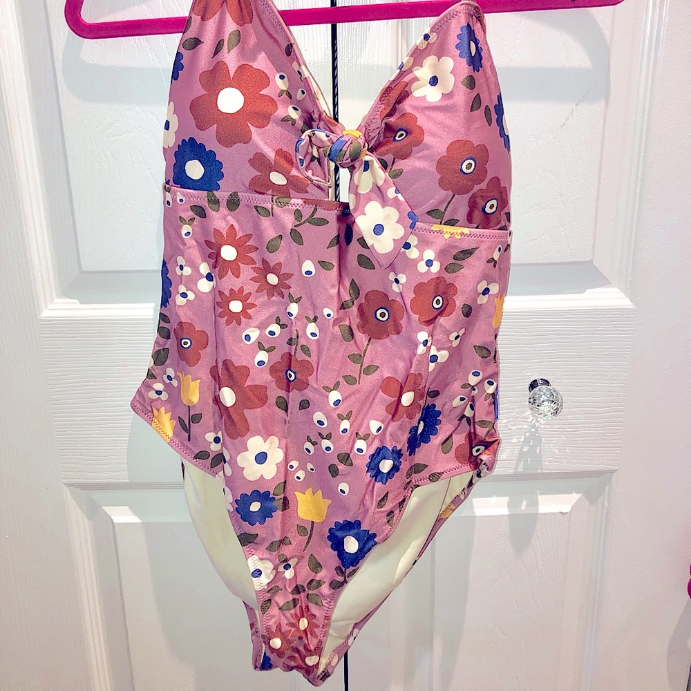 One piece swimsuit, new with tags. Never worn, never tried on. Fun retro print.